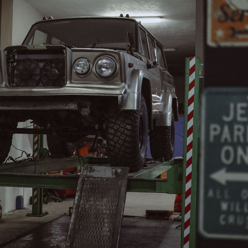 4x4 raised on a lift in the workshop
